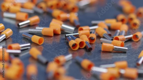 A set of metal bits for installation work in a plastic case.