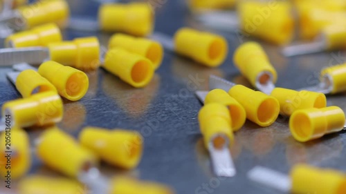 Metal tips with a plastic base for copper electrical wires. 