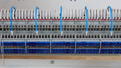 Marking electrical wiring wires with thermally printed nylon tape. 