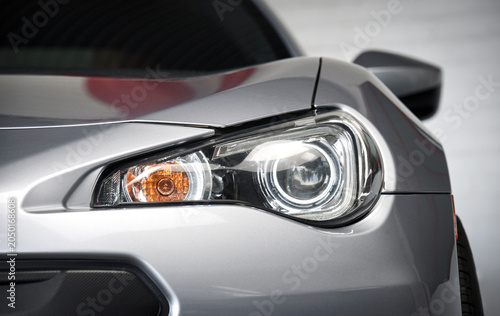 Front corner headlight of a car at a car show