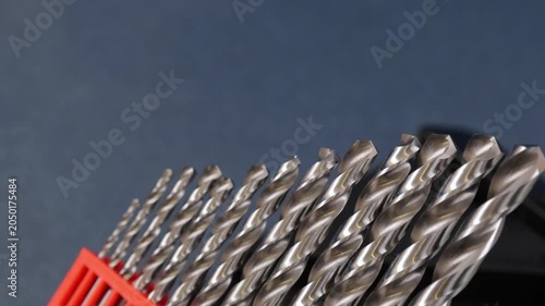 A set of drills for drilling metal in a plastic case.