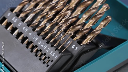 A set of drills for drilling metal in a plastic case.