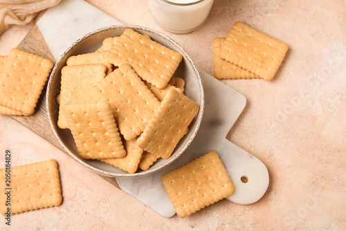 Bowl with tasty biscuits on...