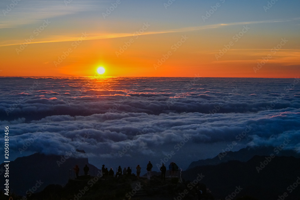 Fototapeta premium Sunrise Above the Clouds at Pico do Arieiro Mountain Peak