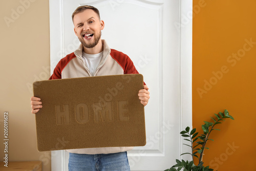 Funny young man with doorma...