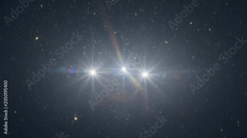 Triple starburst lens flare overlay with floating dust particles on dark background
