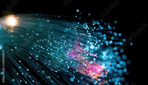 Glowing strands of fiber optics emanate a soft, luminous glow against a dark background