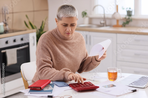 Mature woman in debt with p...