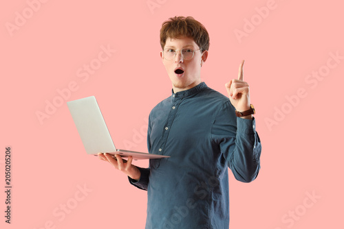 Shocked young man with lapt...