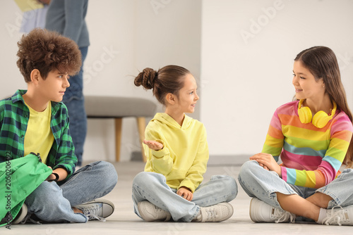 Children sitting at exhibit...