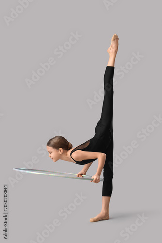 Cute girl with hula hoop do...