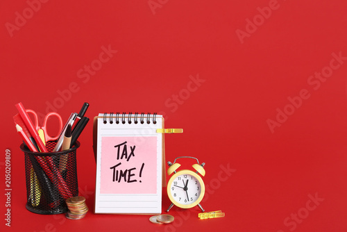 Notebook with text TAX TIME...