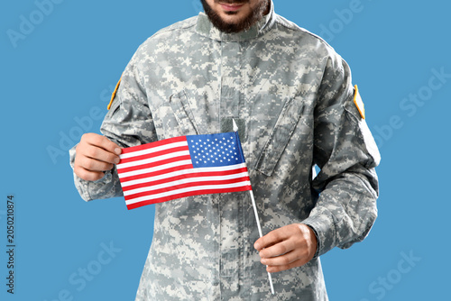 Soldier with USA flag on bl...