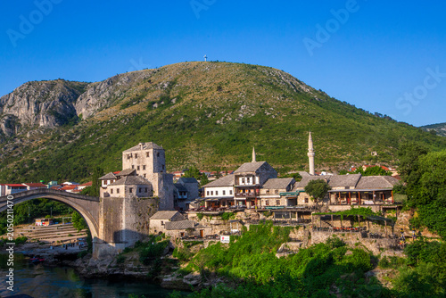 Fotografía Scenic View of Mostar Old Town with Tara Tower and Hum Mountain Cross in Bosnia