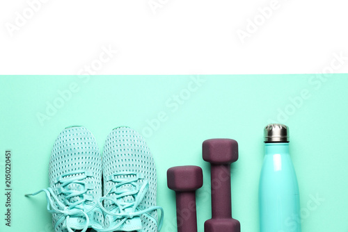 Sportive shoes, dumbbells a...