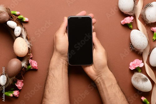 Male hands with modern mobi...