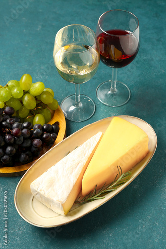 Plates with tasty cheese, g...