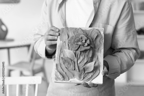 Young male sculptor with cl...