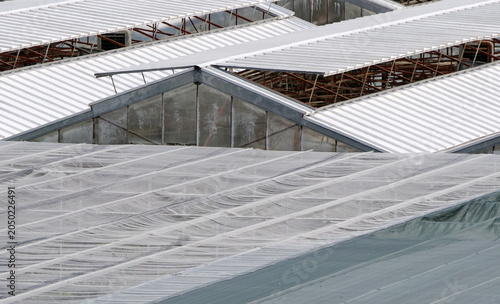Glass and fiberglass greenhouse roofs