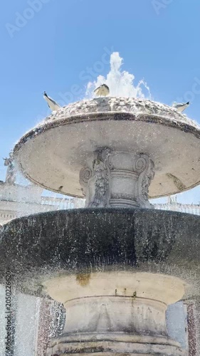 Baroque fountain with cascading water in Saint Peter's Square Vatican Rome