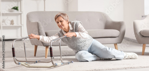 Mature woman with walker fa...