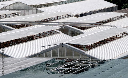 Glass and fiberglass greenhouse roofs