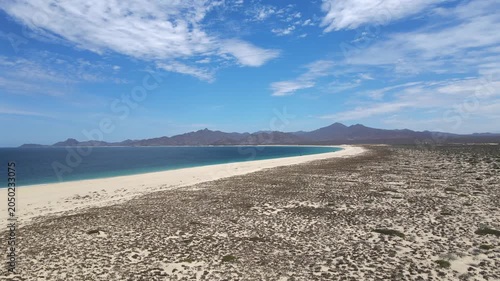 Wide aerial panorama of Punta Arena beach and desert coast in Mexico.