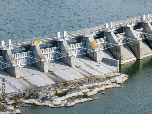 Concrete dam with multiple gates stands prominently