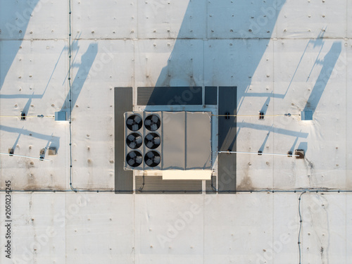 Drone shot captures an HVAC unit on a concrete roof
