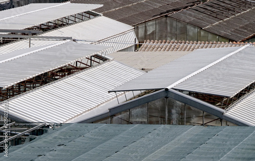 Glass and fiberglass greenhouse roofs