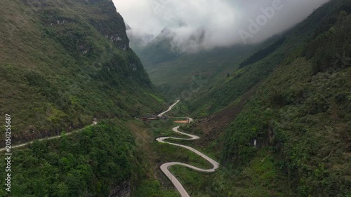 Aerial View Of the Winding Tham Ma Mountain Pass In Ha Giang Province In Vietnam - Ha Giang Loop Drone Shot at Sunset.