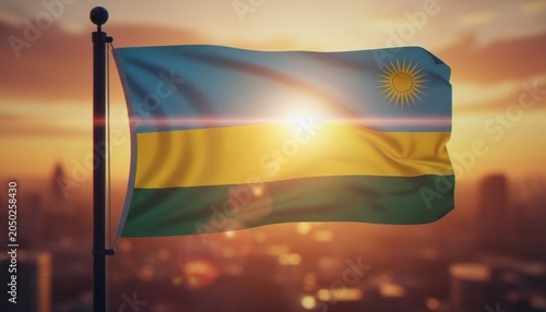 Schilderij op canvas The national flag of Rwanda waving against a dramatic golden sunset over a blurred city skyline