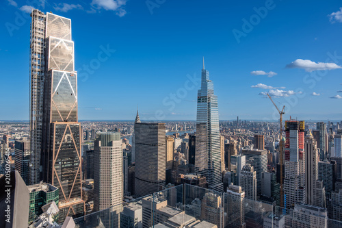 New york, usa august 21,2024. Manhattan skyline showcasing skyscrapers on a sunny day. Capturing urban architecture, growth, and development in new york city