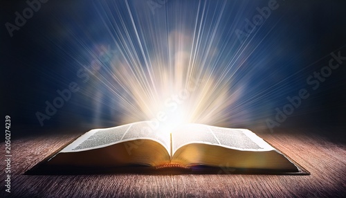 open bible shining with rays of light illuminating the room