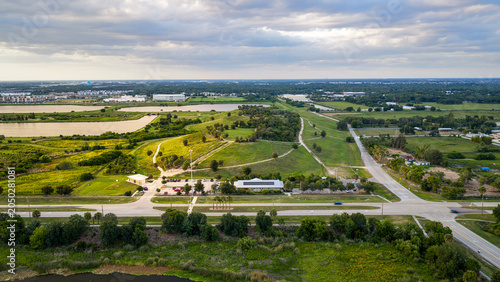 Photography A glowing sunset illuminates the prominent hill of Celery Fields—a landmark in Sarasota, Florida