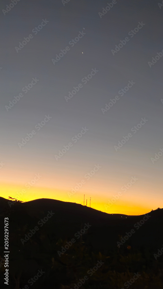 Obraz premium A beautiful sunset over the mountains of Minas Gerais.