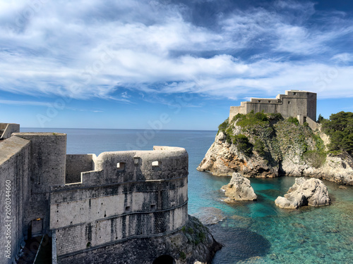 Harbor of Dubrovnik city in Croatia with Adriatic Sea, ancient walls and buildings during nice day