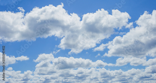 Softly white clouds in a blue sky. Natural pattern of abeautiful cloudy sky.