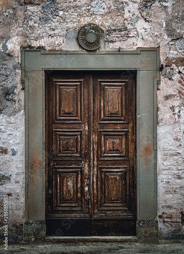 Ancient wooden door. Old-fashioned portal of an historical building.