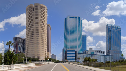 A panoramic view looking down the road of the Kennedy Boulevard Bridge toward skyscrapers and high rise office towers in the downtown city center of Tampa