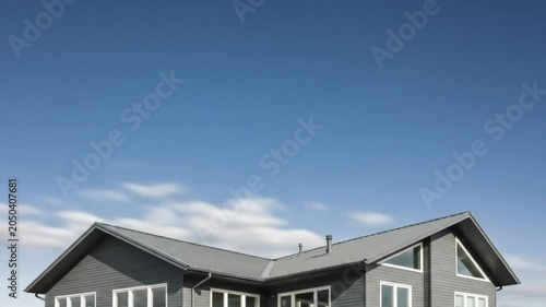 Modern House with Dynamic Sky Timelapse Architectural Elegance Under Changing Clouds.
