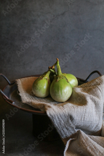 Thai eggplant rest on fabric table, creating healthy, delicious display of nature's vegetable bounty