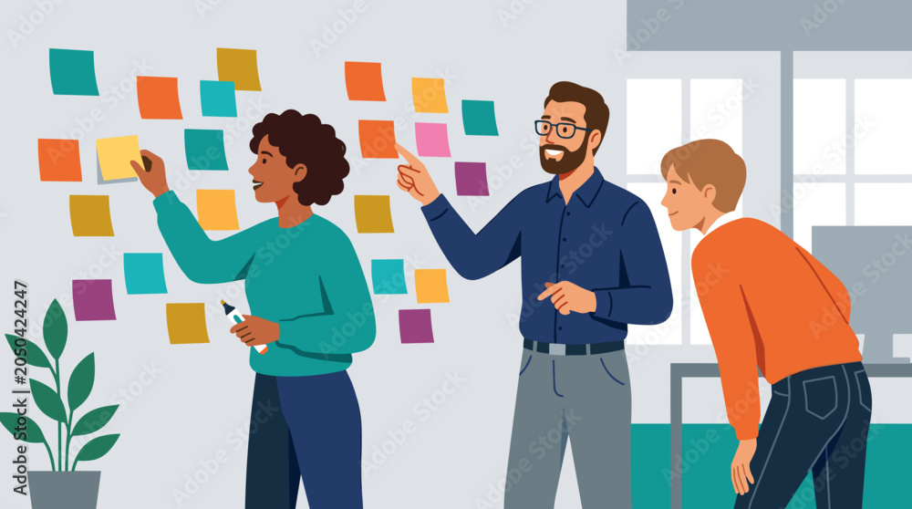 Fototapeta premium Diverse office workers brainstorming with colorful sticky notes on a wall in a modern meeting room