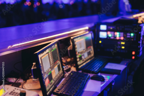 Bild auf Leinwand Lighting engineer operator working on mixing console workplace during live event