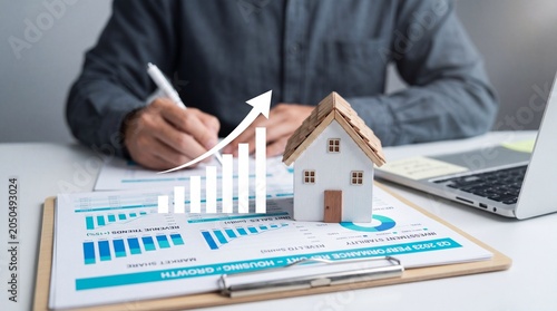 Real estate agent analyzing house market growth with charts