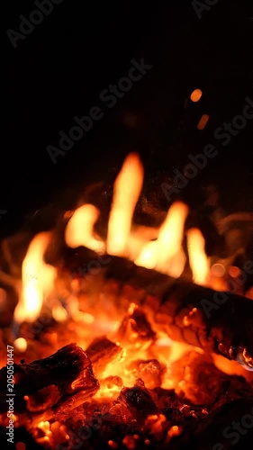 Close-up of burning flames at night.
