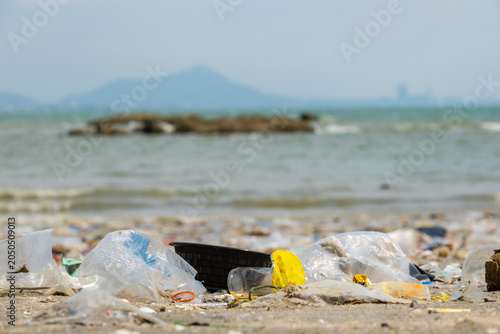 Картината върху платно Polluted beach with plastic waste and garbage washed up on the shore, environmen