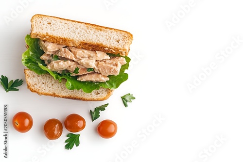 Fresh Chicken Salad Sandwich with Lettuce on Whole Wheat Bread, Cherry Tomatoes and Parsley Garnish