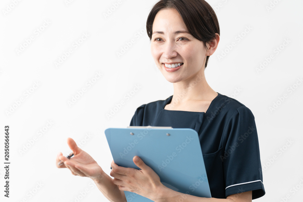 Fototapeta premium エステサロン制服を着た若い女性 ビューティイメージ