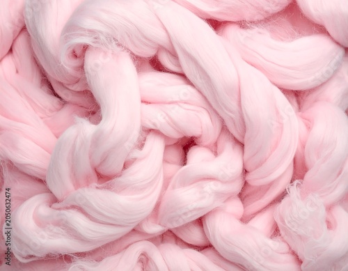 Abstract close up of soft pink fiber material with texture and detail